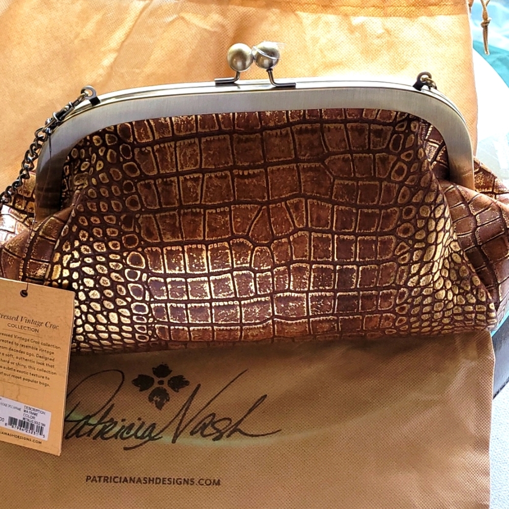 PATRICIA NASH BRONZE WITH GOLD TONE HANDBAG.